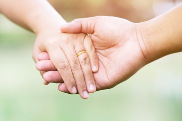 Woman and man holding hands, Happy couple holding hand in hand love in the parks. concept couple lover valentine day.