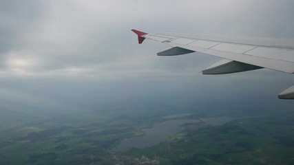 Cloudscape and plane wing