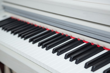 Close up of wooden white piano keys