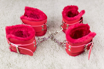 Red handcuffs for love games.