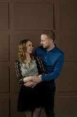 Gentle quivering young couple stands in an embrace