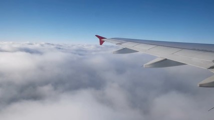 Cloudscape and plane wing