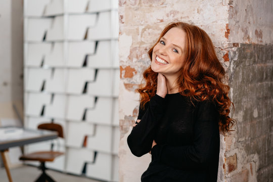 Portrait of a happy redhead woman smiling