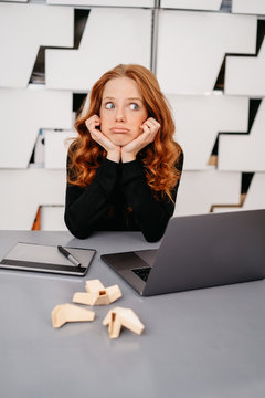 Glum looking businesswoman in a modern office