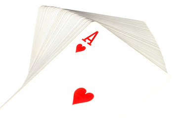 Full deck of playing cards with ace of hearts on top, isolated on white background