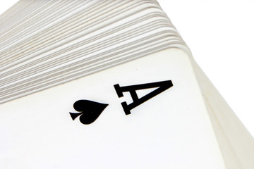 Full deck of playing cards with ace of spades on top, isolated on white background