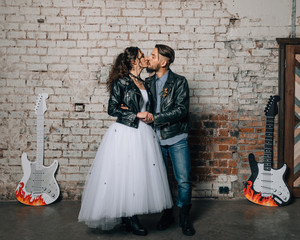 Wedding in the style of rock. Rocker or Biker wedding. Guys with stylish leather jackets. It's a...