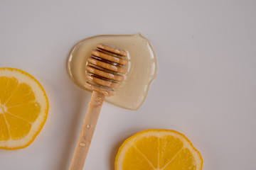 Honey stick and two lemon slices top view