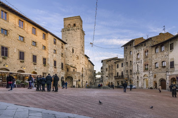 Piazza della Cisterna in the evening light, San Gimignano, Siena, Tuscany, Italy