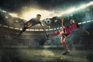 The football player in motion on the field of stadium