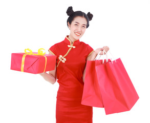 happy woman holding shopping bag and red gift box in concept chinese new year celebration isolated on white background