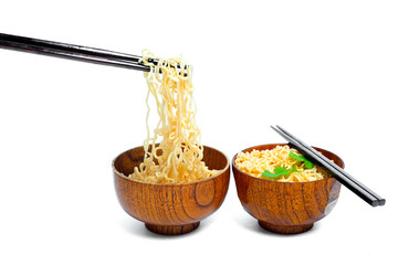 Instant noodles and cup isolated on white background.Instant noodles for people Do not like to eat vegetables.Instant noodles in black cup on white background.