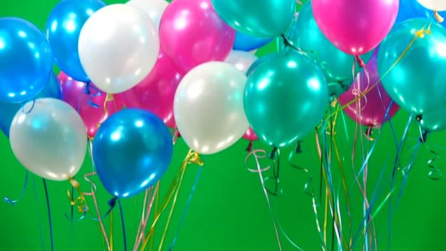 color balloons fly up on the green screen