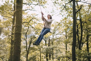 Mature Woman on a Rope Swing