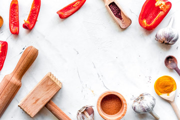 composition of cooking tools and spices on kitchen table top vie