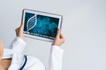 Close of female doctor hands working with tablet pc computer