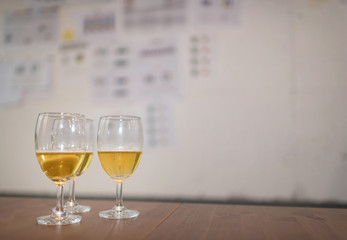 Three of glass of beer on wooden table in office. Setup studio shooting.