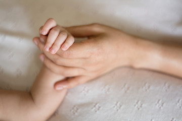 Hand the sleeping baby in the holding and repose one's trust in mother.