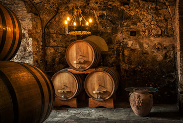 Old Wooden barrels with wine in a wine vault