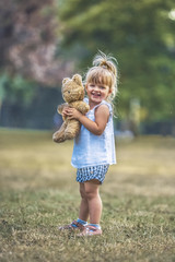 Little Girl Holding Teddy Bear