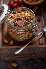Granola with berries, nuts and seeds, energy snack or healthy breakfast concept