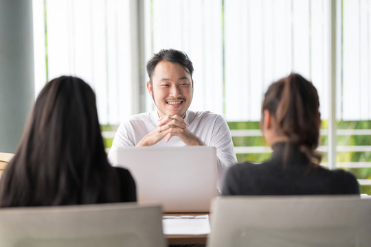 Smiling businessman during job interview.Job interview concept.Businessman explaining and listen to candidate answers