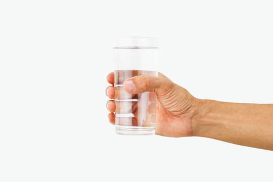 Man hand holding glass of drinking water isolated on white background