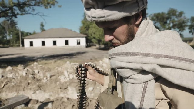 Mujahid gets bullets for his machine gun