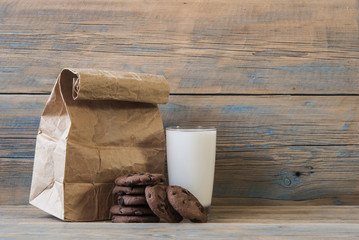 fresh chocolate cookies and brown paper bag