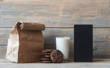 fresh chocolate cookies and brown paper bag