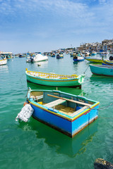 Obraz premium Mediterranean traditional colorful boats in Malta
