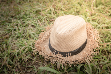 brown hat put on grass