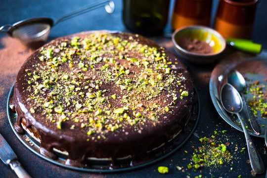 Homemade Chocolate Cake with Dark Chocolate Glaze and Pistachios Nuts