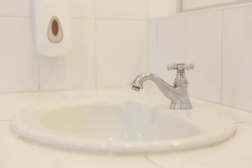 Clean wash basin in the bathroom .