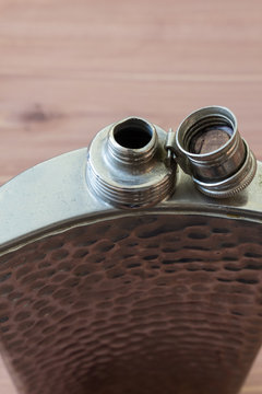 Top view of open flask, drinking alcoholism addiction concept, selective focus, copy space, vertical aspect