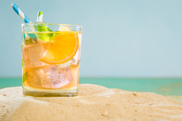 Summer drink on sand beach