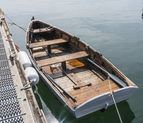 Wooden row boat docked in Maine