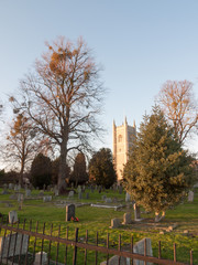Naklejka premium church cemetery with graves and trees country