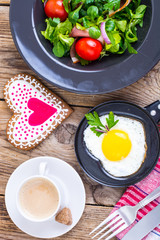 Fried eggs, salad and coffee for breakfast for Valentine's Day
