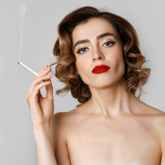 Obraz premium Beautiful girl wth a cigarette. Concept.