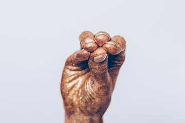 Female hand gesture on a gray background