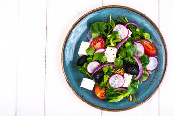 Vegetable salad with black olives and feta