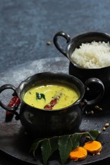 Spiced Turmeric Buttermilk curry served with rice, selective focus