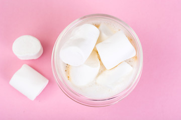 White marshmallow on pink background