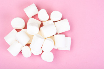 White marshmallow on pink background