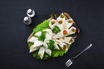 Roll in lavash wrapped salmon with Philadelphia cheese