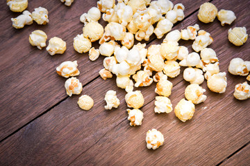 popcorn texture on a wooden table blackground