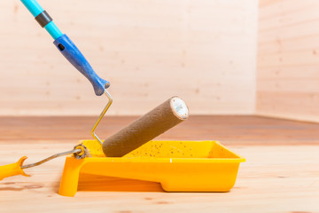 tools for painting houses - roller, paint and tray close-up