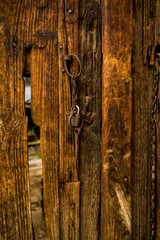Old  wooden door with ancient iron knockers