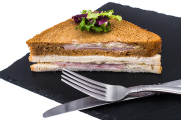 Sandwich with ham and cheese from wheat and rye bread